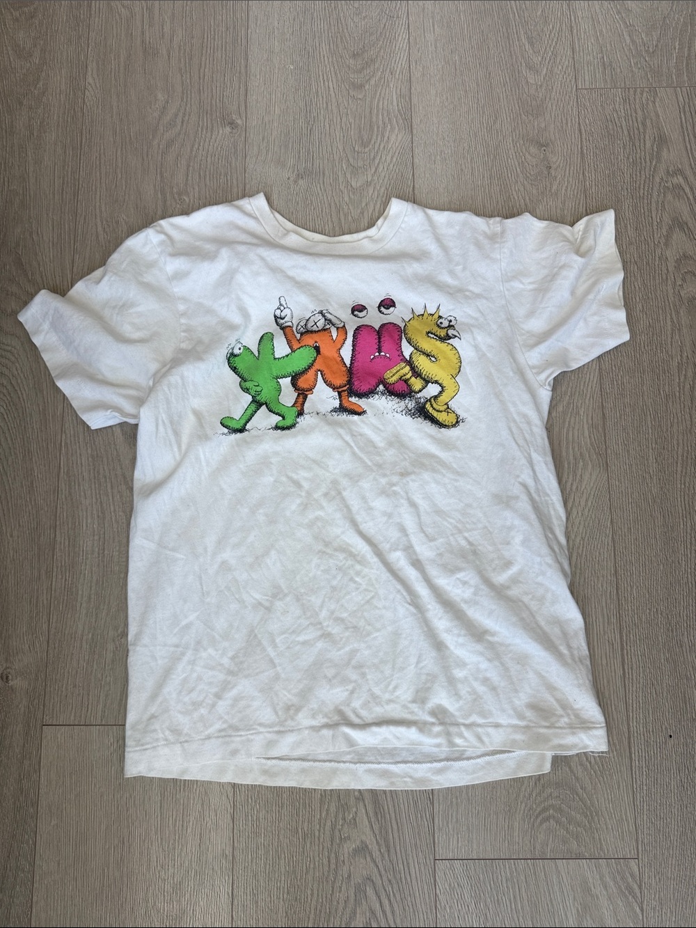 KAWS White Tee with Green Orange Pink Yellow Character Letters
